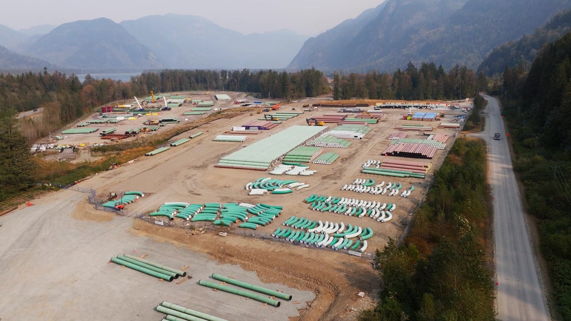 Aerial view of U.S. pipeline construction — pipe yard and industrial facility